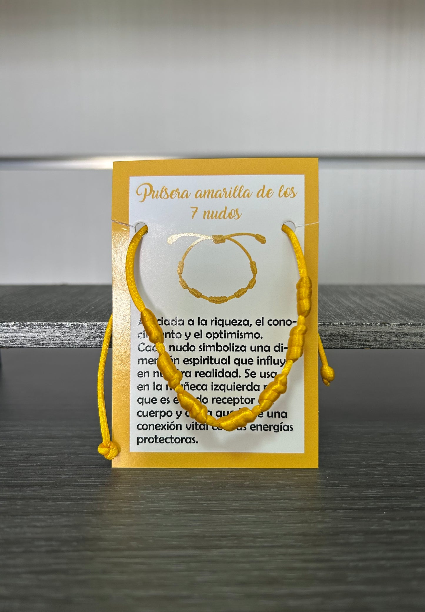 Pulsera 7 nudos amarilla.