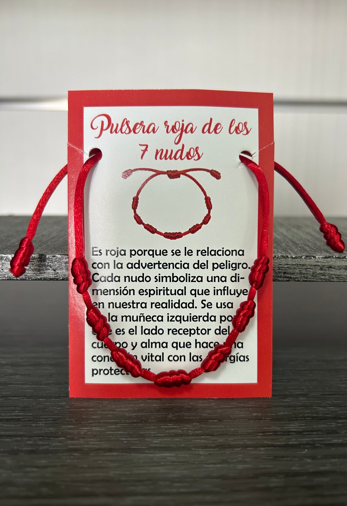 Pulsera 7 nudos roja.