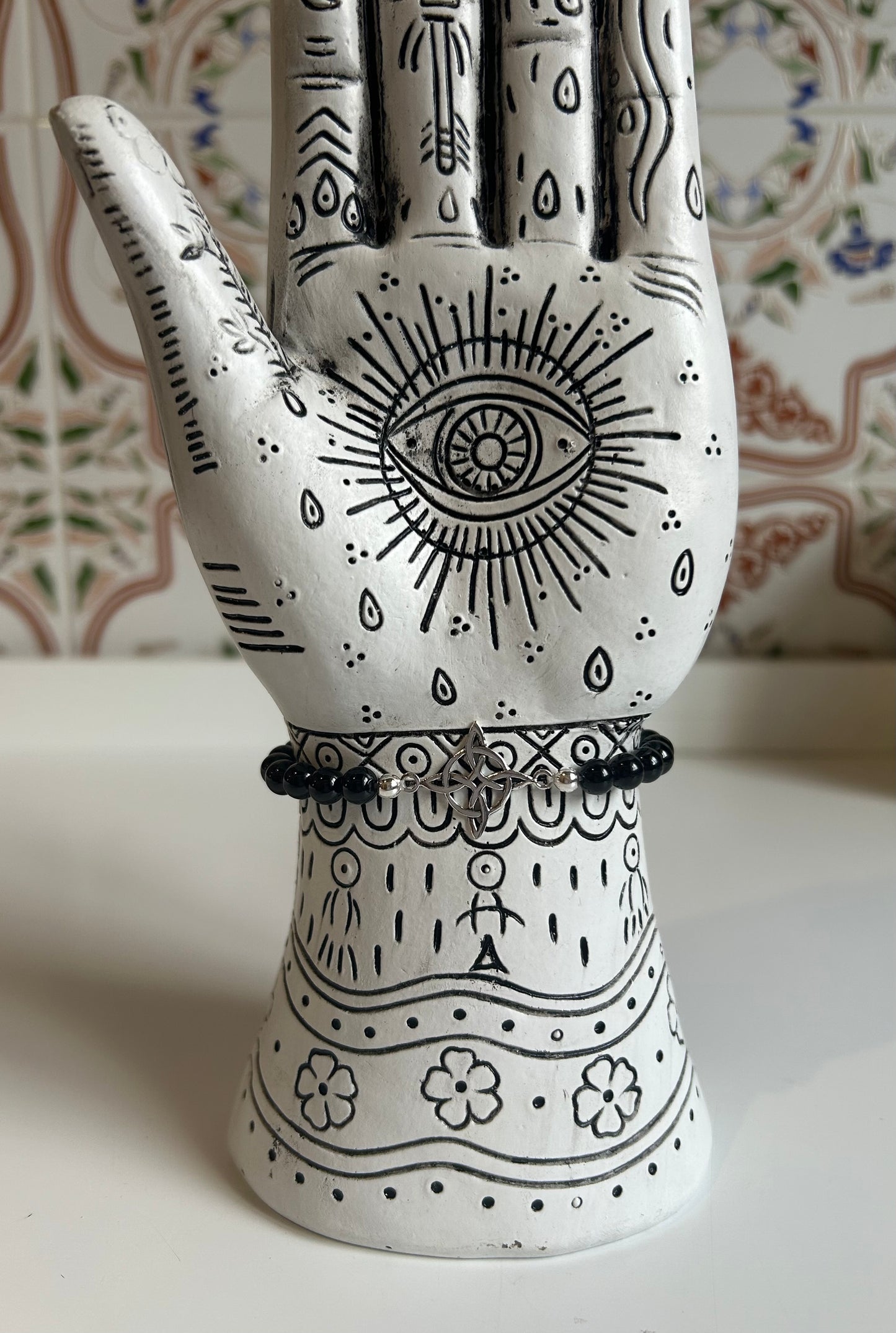 Pulsera de onix con nudo de bruja en plata de ley (0'6mm).