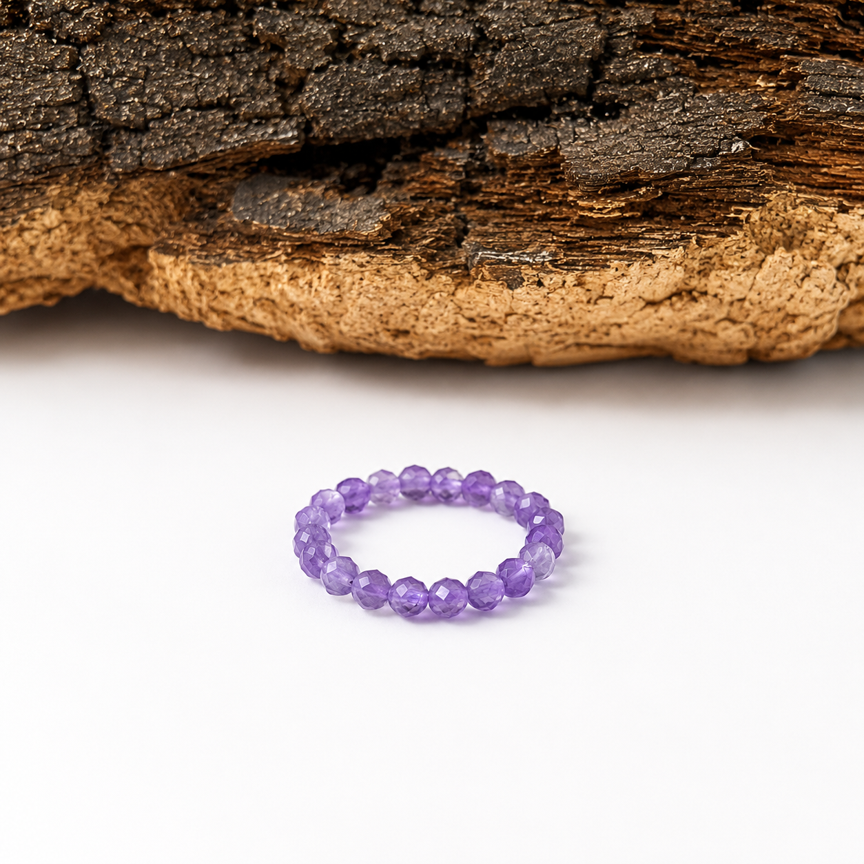Anillo elástico de amatista facetada