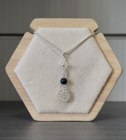 Colgante doble protección con turmalina consagrado y activado).