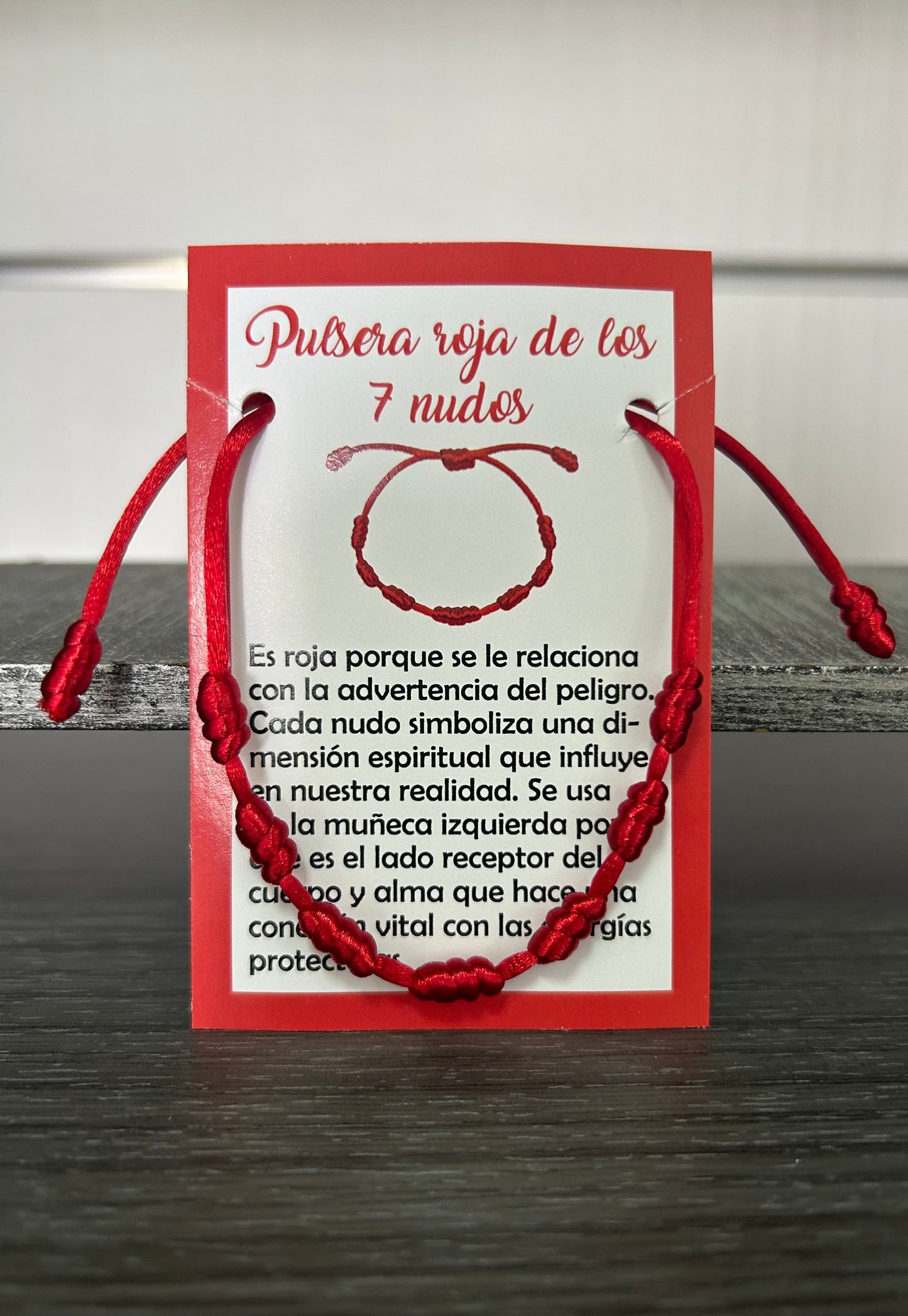 Pulsera 7 nudos roja.