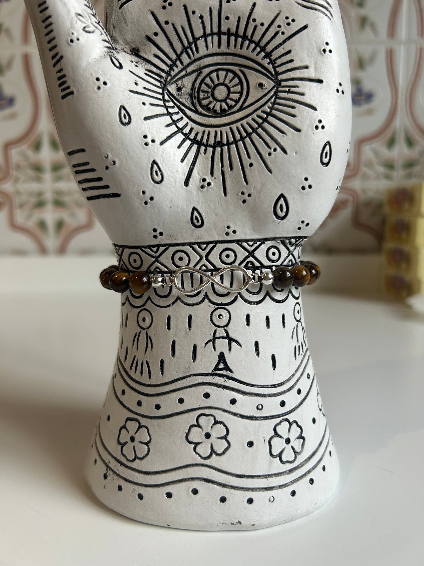 Pulsera de ojo de tigre con infinito en plata de ley (0'6mm).