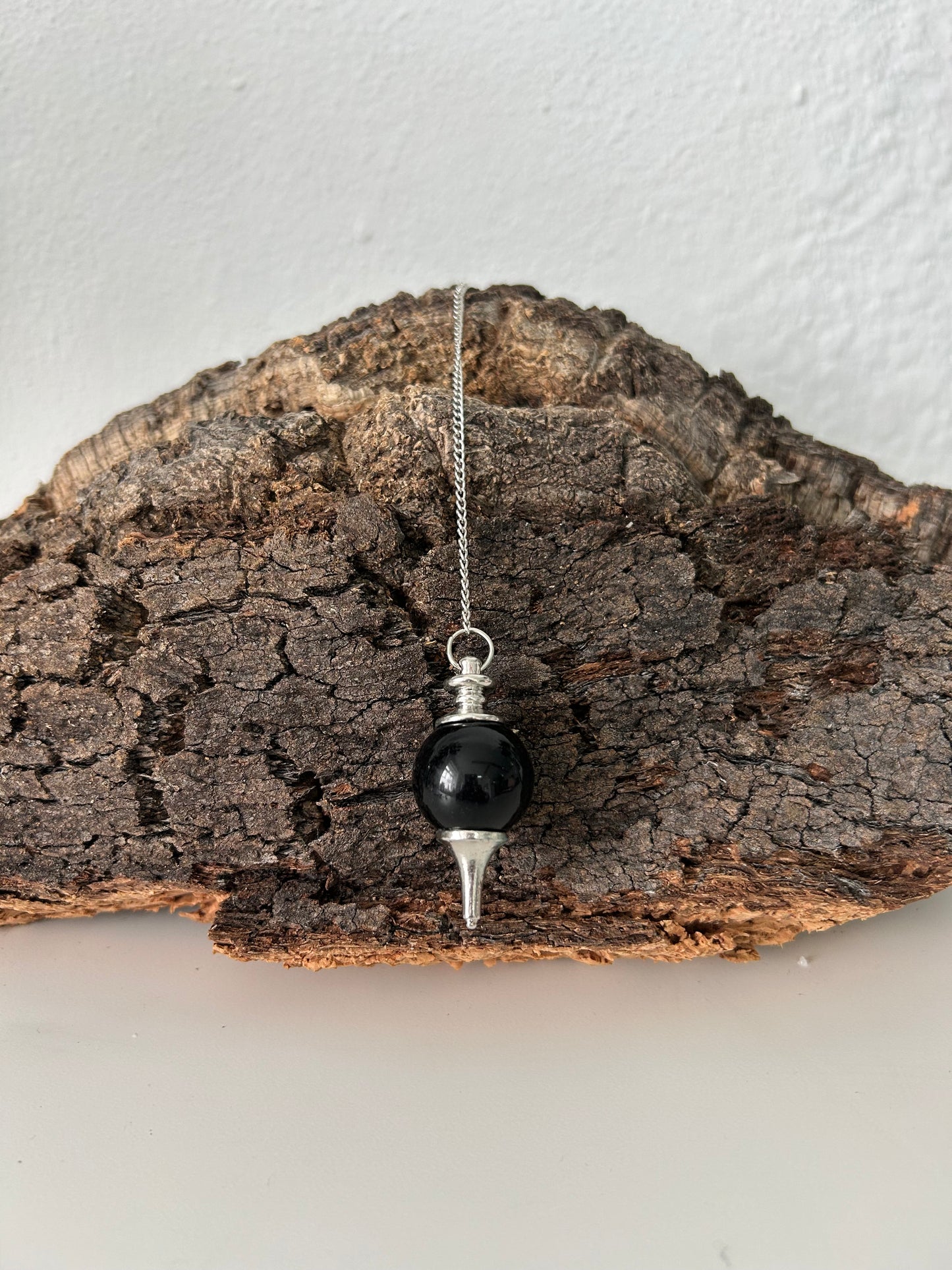 Péndulo de metal con onix